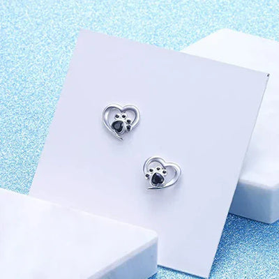 Nina - cardiac paw earpluged with black silver